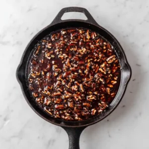 Pecan Pie Dump Cake recipe 59 Dry yellow cake mix spread evenly over pecan pie filling in a cast iron skillet.