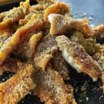 Golden-brown crispy fried morel mushrooms on a skillet for the best morel mushroom recipe