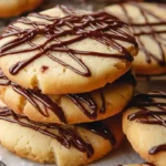 Drizzle chocolate cookies stacked with rich chocolate lines